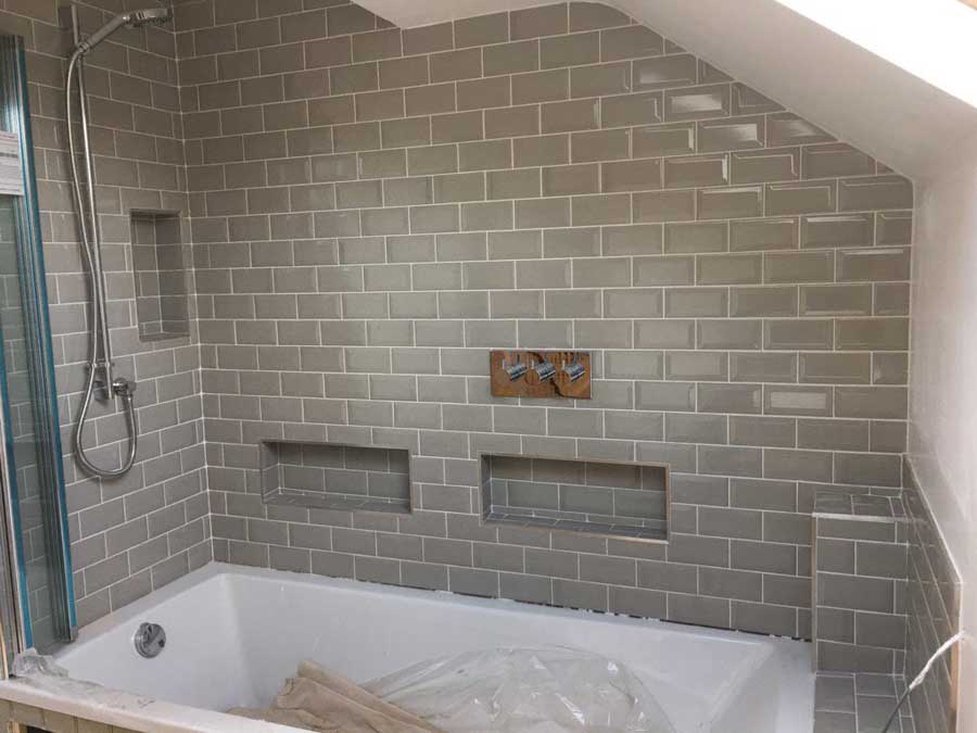 Cracked glaze tiles with 3 recesses tiled in a bathroom in Horley