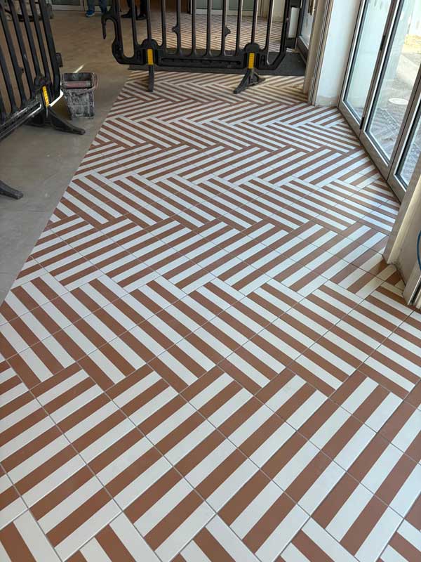 Herringbone effect tiling done in commercial property in Hove