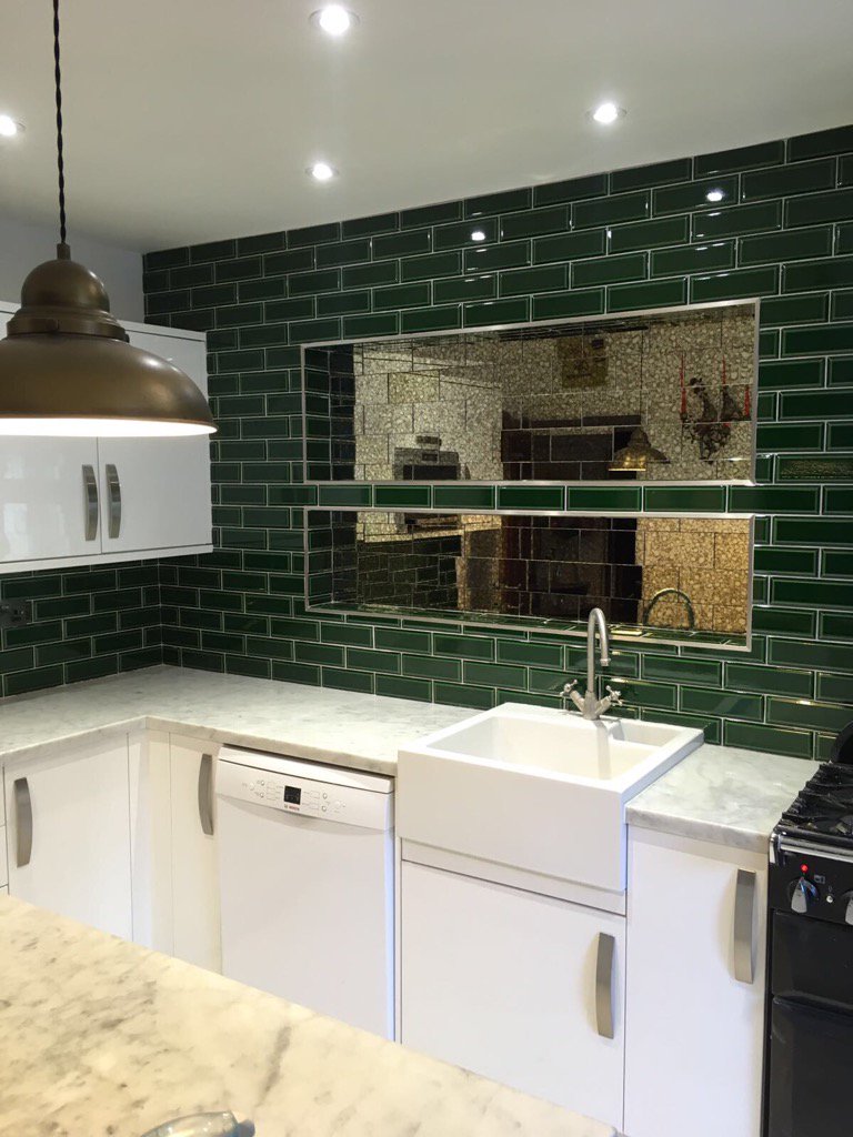 Kitchen splashback with cracked glaze tiles and 2 recesses