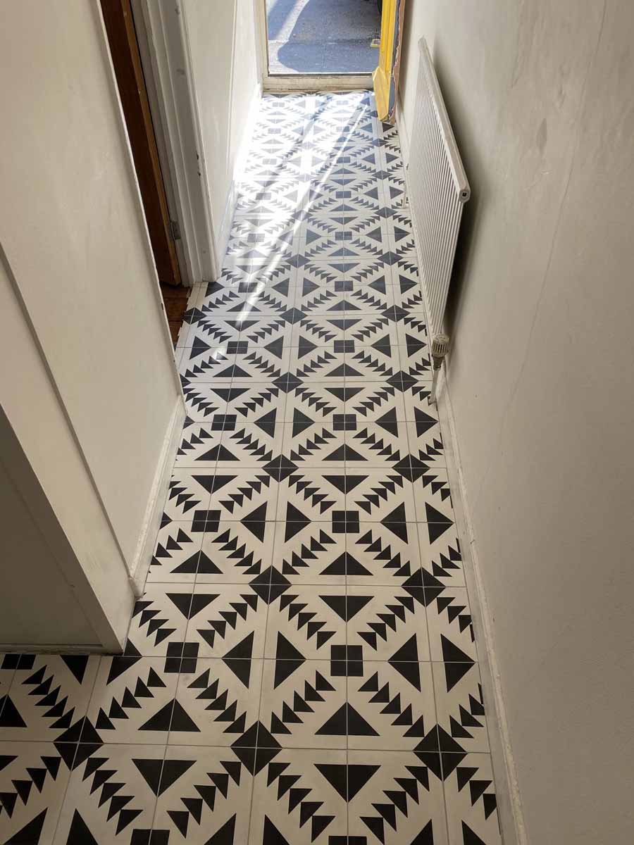 Hallway tiled with cement encaustic tiles