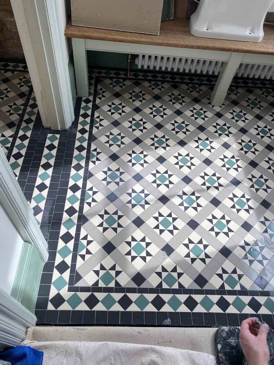 Hall landing and toilet floors tiled in by Brighton
