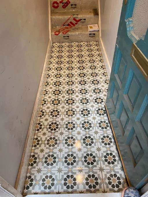 Decorative tiles laid in a hallway in Kingston upon Thames