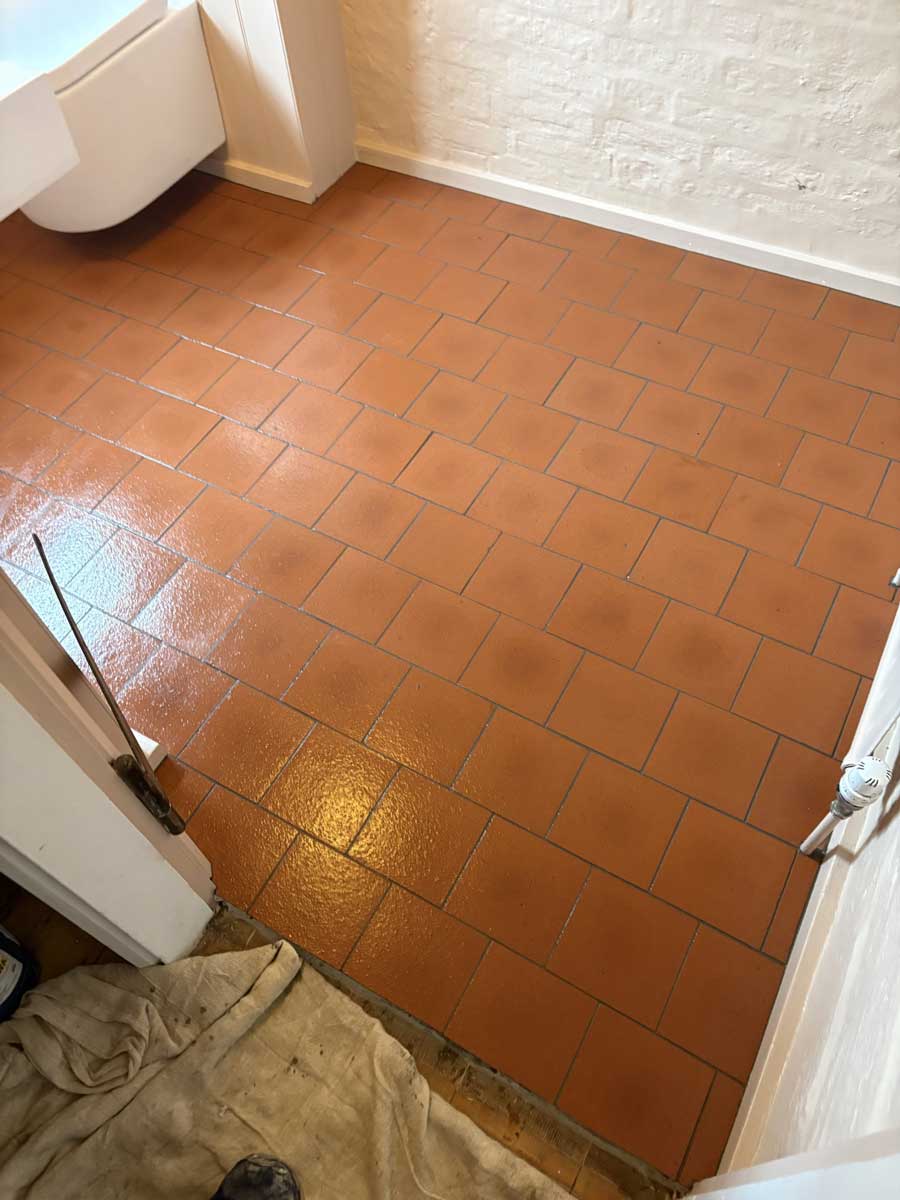 Brick bond quarry tiles on a toilet floor done in Ditchling